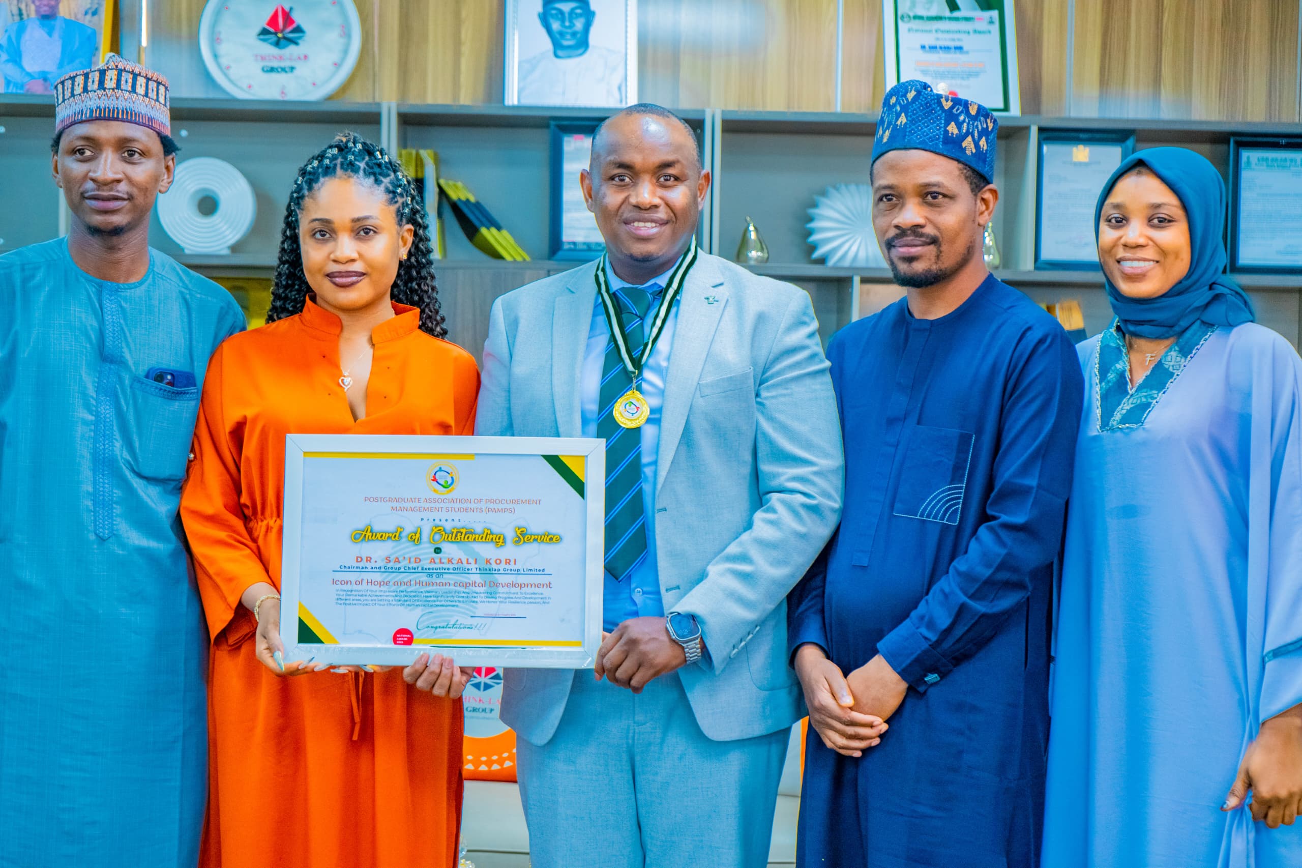 Postgraduate Procurement Management Students Honours Dr. Kori with Outstanding Service Award.